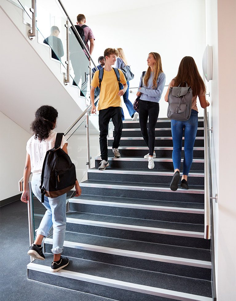 01 high school students walking on stairs between SQE892G